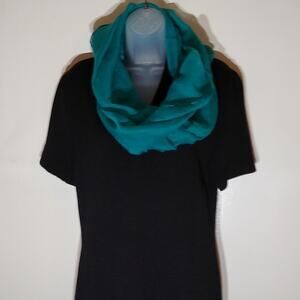 Turquoise infinity scarf. 100 polyester. Very versatile.